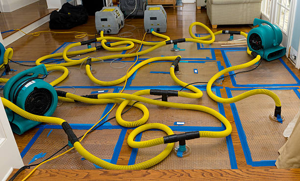 Professional Storm Water Damage Restoration technician working in Tamworth, NH